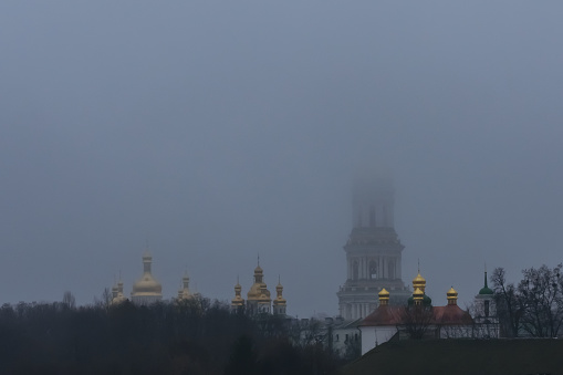 View of the Kiev Pechersk Lavra. Bell tower in fog