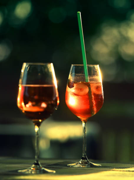 istock Two glasses with wine and cocktail outdoor 1027838238