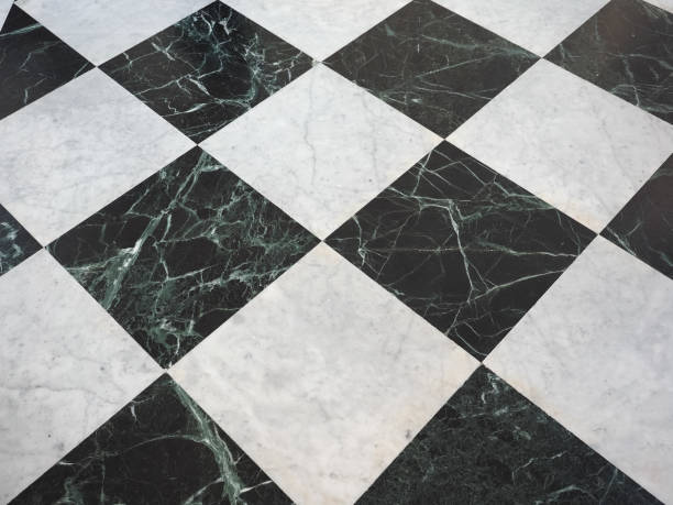 istock chequered white green and black stone floor background 1027839182