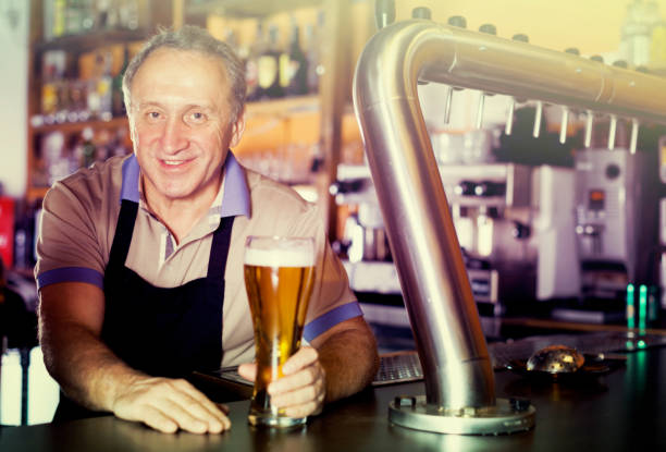 istock Barman is standing with golden beer 1027848472