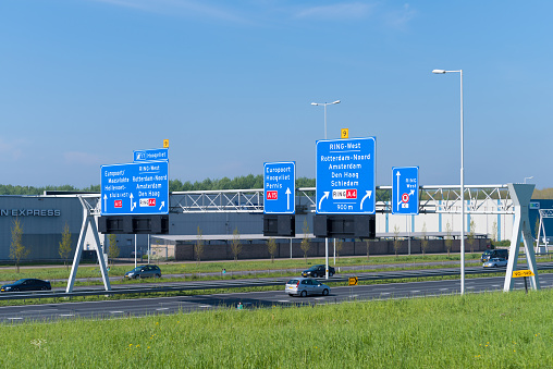 Rotterdam, Netherlands, May 6, 2017: Directional highway road signs above the Rotterdam A15, a main highway in the harbor area