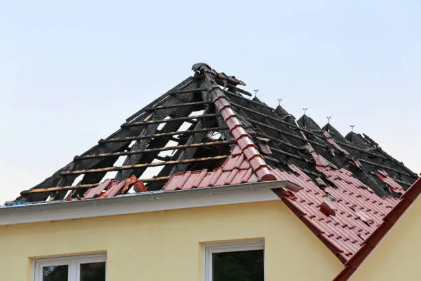 burnt out roof top of a dwelling in Germany