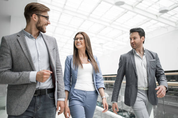 istock group of managers talking in the business cente 1027859140