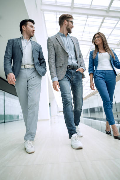 istock group of business people in the office hall 1027863126