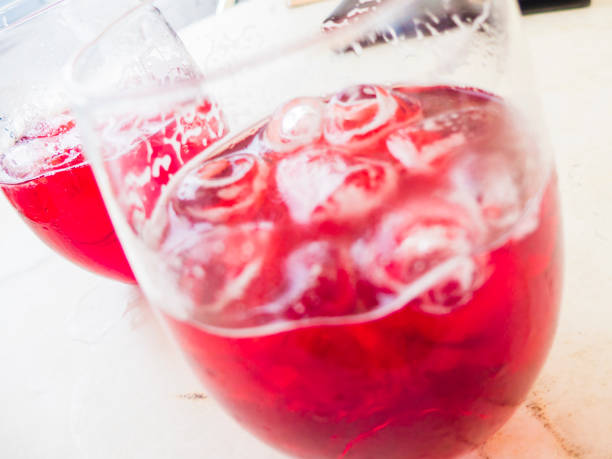 istock vibrant pink raspberry beer on the rocks ice 1027864896