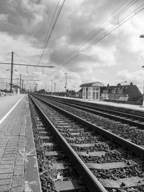 istock Train platform station railroad tracks derelict abandoned 1027864932