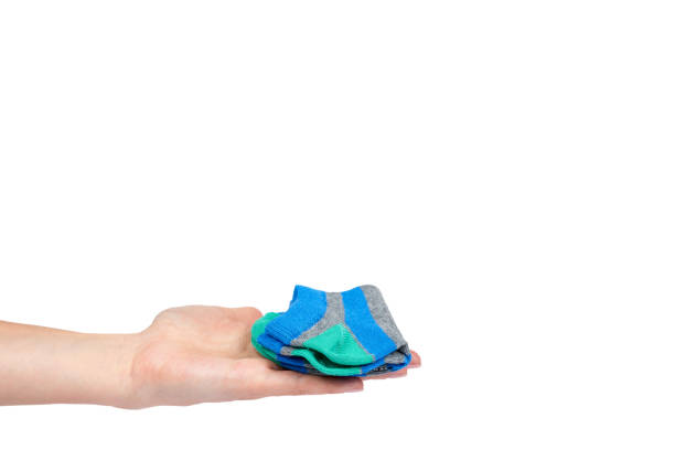 istock Cotton kid sock with hand isolated on white background, copy space template 1027867356