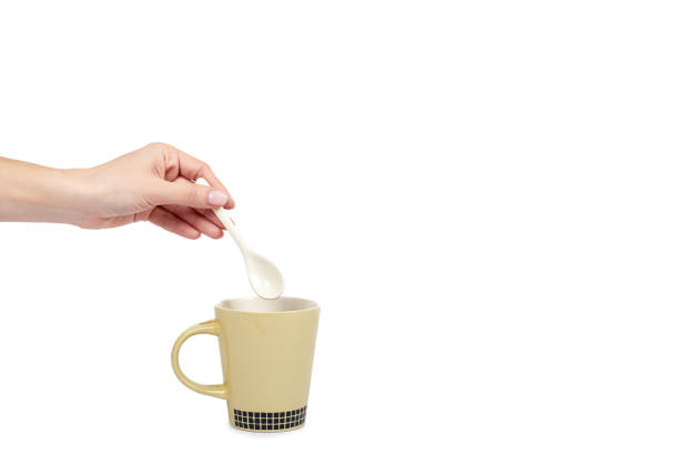 istock Porcalain brown tea cup with hand isolated on white background, copy space template 1027867454