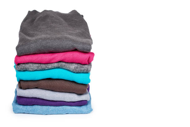istock pile of multi color fabric texture, wool cloth isolated on white background, copy space template 1027868170