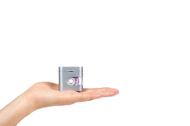 istock Dental floss in grey container with hand isolated on white background, copy space template 1027868368