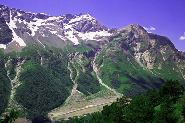 istock Pastoral view on mountains in valley near Elbrus 1027869018