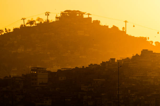 Morro do Alemão Sunset in the set of favelas of RJ. favela stock pictures, royalty-free photos & images