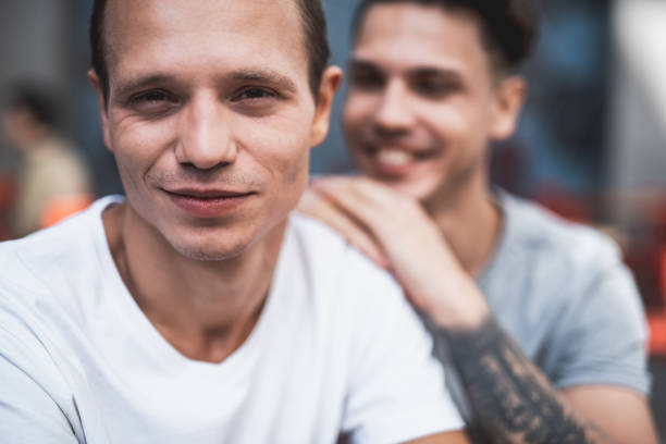istock Satisfied guys having fun during funny communication 1027879592