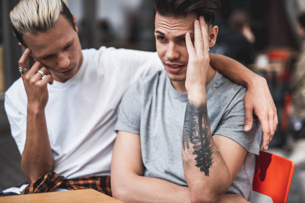 istock Sad males keeping head during communication outside 1027879680