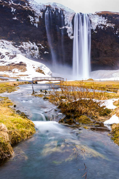 istock Big Seljalandsfoss waterfalls in snowy Winter Iceland 1027889526