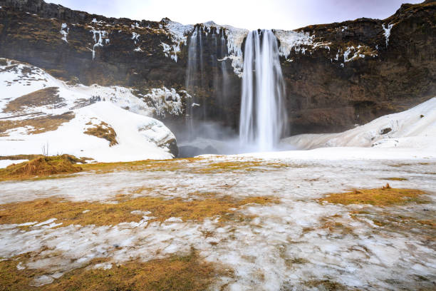 istock Big Seljalandsfoss waterfalls in snowy Winter Iceland 1027889528