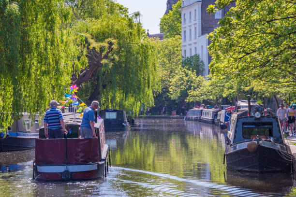View of the Regent's Canal in Camden Scenic view of a boats on the Regent's Canal in Camden, a famous canal which runs through the city May 05, 2018 in London little venice london stock pictures, royalty-free photos & images