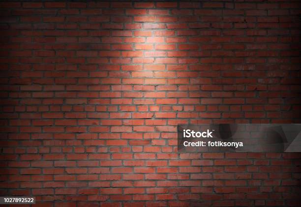 Abstract Old Brick Wall In The Dark With Spotlight Warm Light Tone Stock Photo - Download Image Now