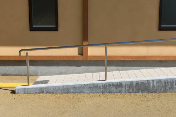 slop path to toilet with handrail metal stainless bar for disable and toilet wall slop path to toilet with handrail metal stainless bar for disable and toilet wall with window in background pebble driveway stock pictures, royalty-free photos & images