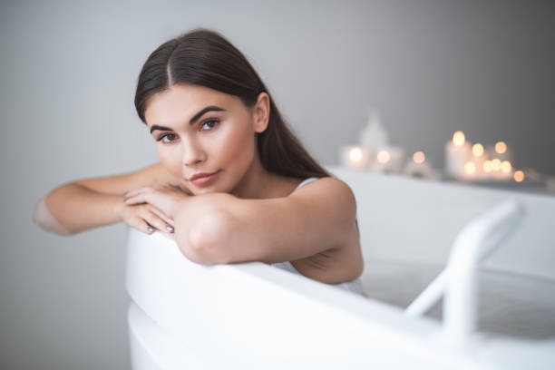 istock Thoughtful woman relaxing during spa procedure indoor 1027900662