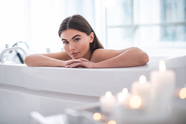 istock Serene female having rest in modern bathroom 1027900668