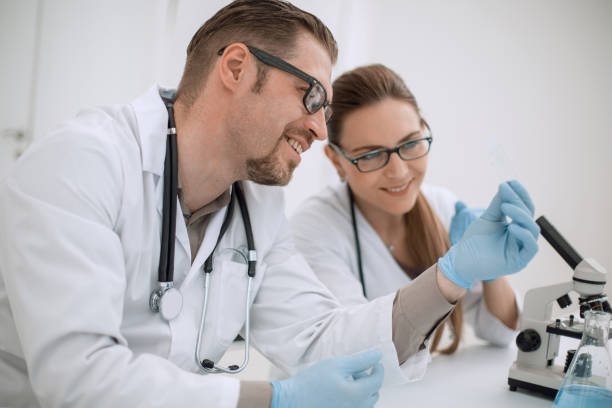 istock two scientists are conducting tests in the laboratory 1027903710