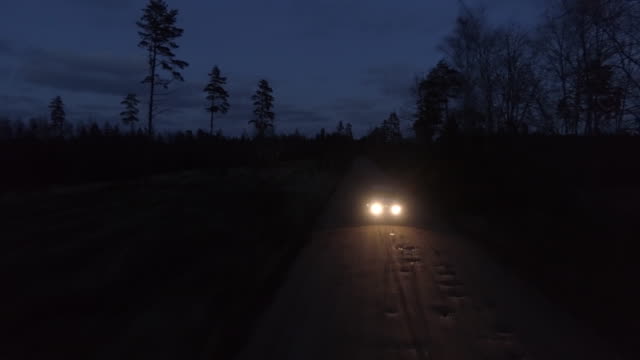Aerial drone shot of 4x4 driving in night