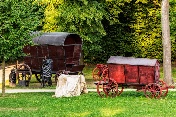 Two Chuck Wagons in the Garden Two Chuck Wagons in Wilanow Garden chuck wagon stock pictures, royalty-free photos & images