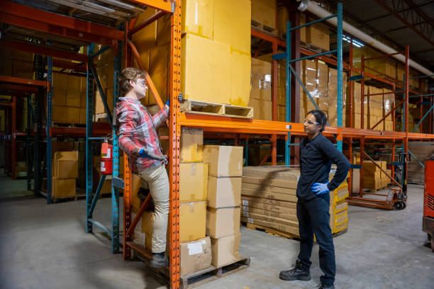 istock A young male warehouse worker breaking safety regulations by climbing-up racking 1027937780