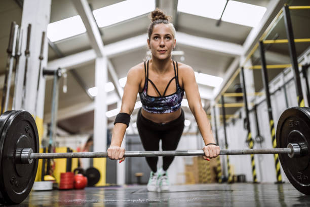 istock Athletic Woman Doing Push Ups With Weights 1027938188