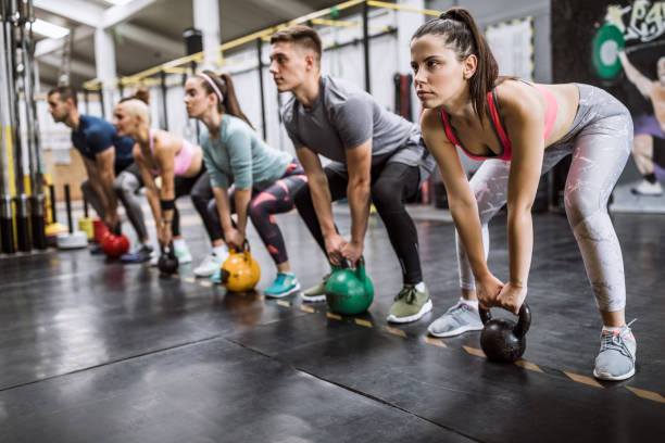 istock Group of people Doing Dumbbell Workout 1027938208