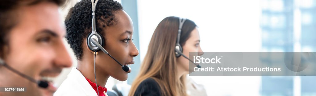 Group of diverse telemarketing team in call center office banner background Group of diverse telemarketing customer service staff team in call center banner background Call Center Stock Photo