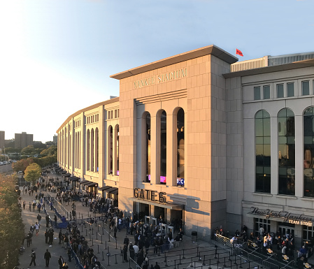 Bronx, New York - October 17: Front gate of Yankee Stadium with fans lining up to see the game.  Taken October 17, 2018 in New York.