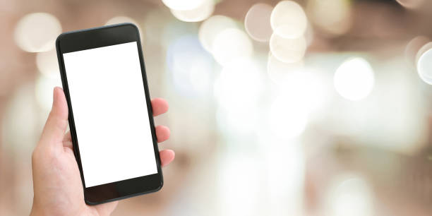 istock Hand using smart phone with blank screen over blur bokeh light background, business and technology, internet of things concept 1027956068