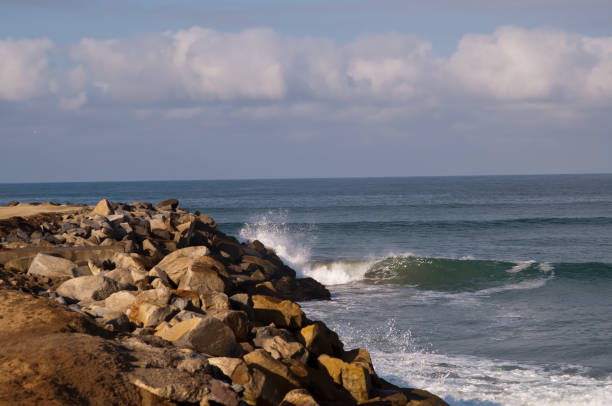istock Waves crashing on a rocky coastline on the Pacific ocean 1027958520