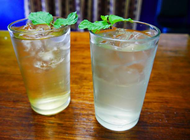 two glasses of cold water with fresh mint leaves