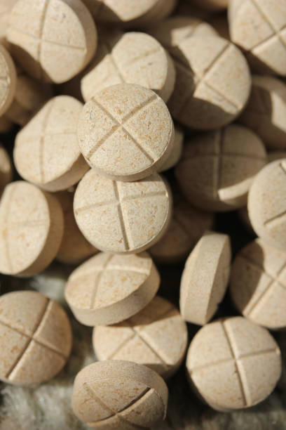 istock A closeup of a stack of tablets with X of them 1027966516