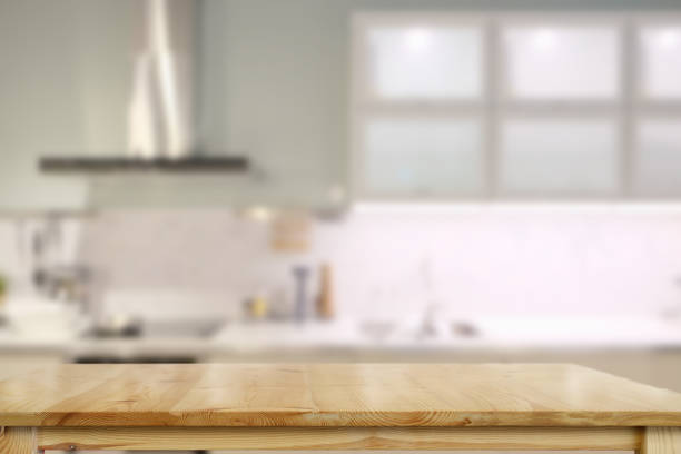 istock Empty top table for product or food montage with modern kitchen room background. 1027968768