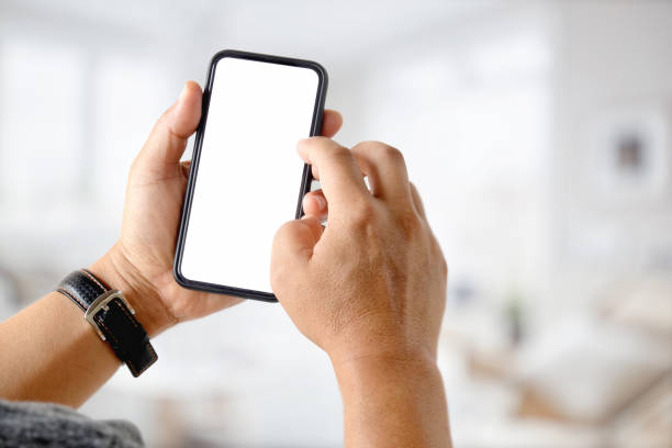 istock Businessman using a mobile phone. Blank screen smart phone for graphic display montage. 1027969016
