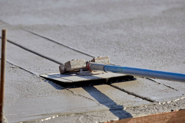istock A mason using an edger to finish a concrete slab 1027978268