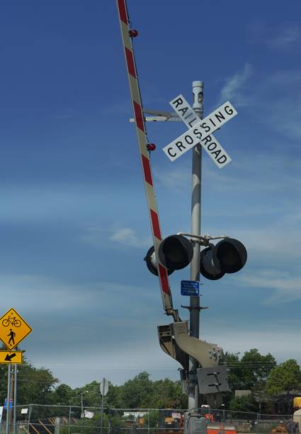 istock Railroad crossing sign in a downtown area, 1027988076