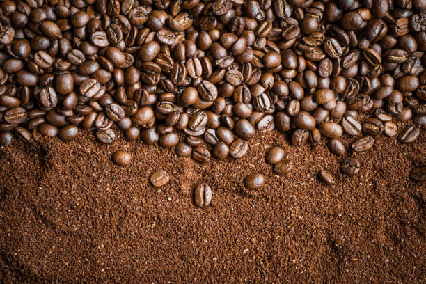 istock coffee bean Roasted and crushed background On the blackboard 1028005266