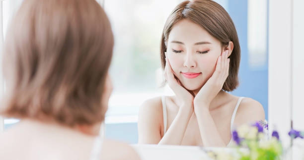istock beauty woman touch her face 1028008790