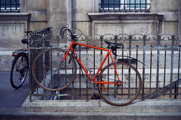 istock Red bicycle parked in the street 1028038208