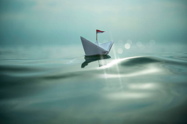 istock Paper boat on the sea 1028041294