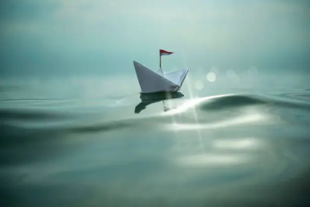 Paper boat on the sea