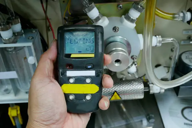 Personal H2S Gas Detector,Check gas leak. Safety concept of safety and security system on offshore oil and gas processing platform, hand hold gas detector for check hydrocarbon leak to protect fire and explosion.