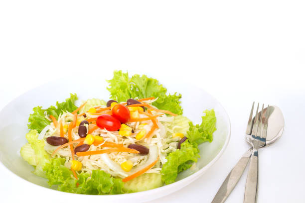 istock green salad plate fresh vegetable border on white background 1028050254