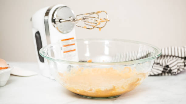 istock Mixing ingredients for vanilla cupcakes. 1028050304