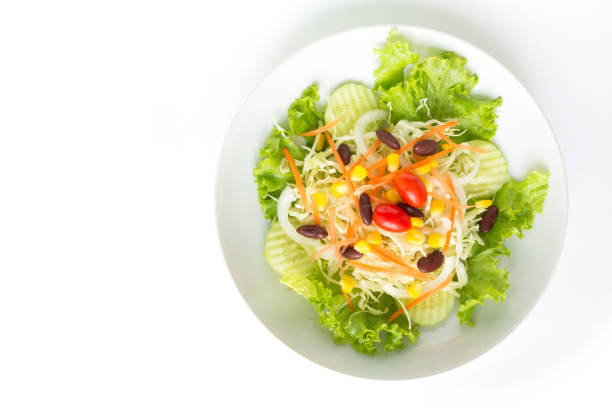 istock green salad plate fresh vegetable border on white background 1028050322